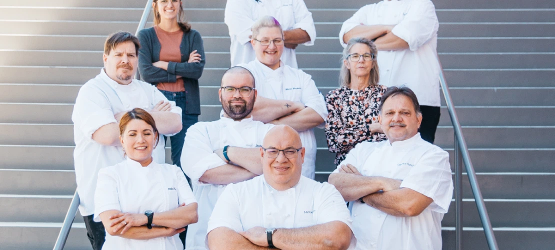 Catering team group photo with chefs