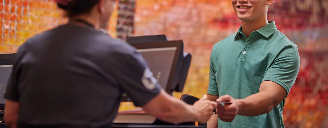 Student paying with his meal plan