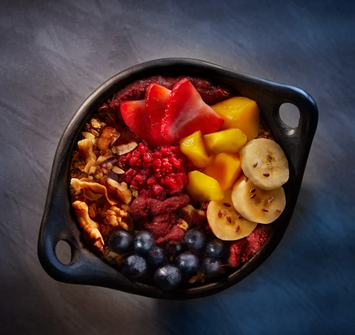 Acai Bowl with cut up fruits on it