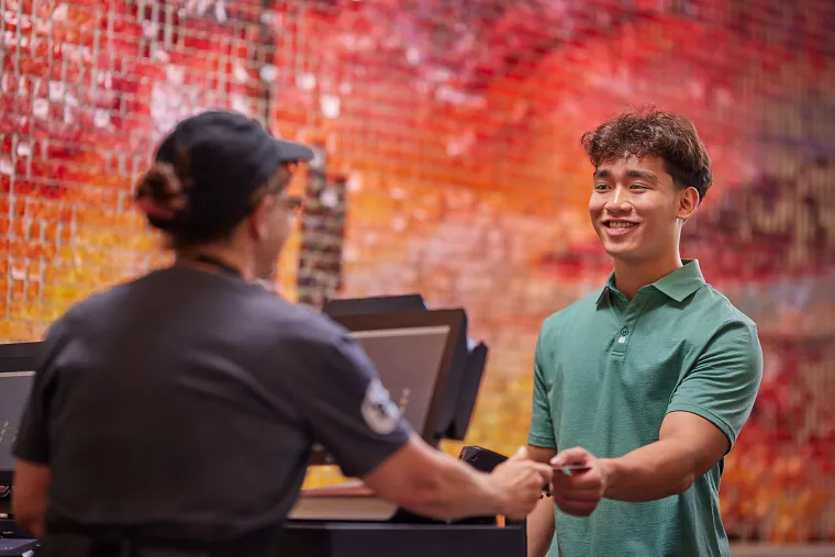 Student paying with his meal plan